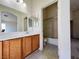Well-lit bathroom featuring a sink, mirror, and combination shower-tub at 6459 Rusticated Stone Ave # 103, Henderson, NV 89011