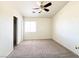 Bedroom featuring a closet, a ceiling fan, and a bright window at 6459 Rusticated Stone Ave # 103, Henderson, NV 89011