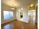Bright dining area with chandelier and large window, adjacent to kitchen at 6459 Rusticated Stone Ave # 103, Henderson, NV 89011