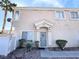 Charming townhome with well-kept landscaping and a secure entry door at 6459 Rusticated Stone Ave # 103, Henderson, NV 89011