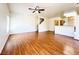 Spacious living room with wood laminate flooring and staircase access at 6459 Rusticated Stone Ave # 103, Henderson, NV 89011