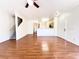 Open-concept living room with hardwood floors and staircase at 6459 Rusticated Stone Ave # 103, Henderson, NV 89011