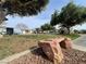 Well-maintained community park with mature trees, playground, and recreational space for residents at 6459 Rusticated Stone Ave # 103, Henderson, NV 89011
