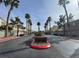 Boulder Ranch community entrance lined with mature palm trees and manicured landscaping at 6459 Rusticated Stone Ave # 103, Henderson, NV 89011