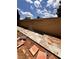 Backyard patio area with clear blue sky and natural desert landscaping at 6460 Linda Ln, Las Vegas, NV 89103