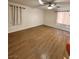 Spacious bedroom with laminate flooring, ceiling fan, and natural light creates a relaxing atmosphere at 6460 Linda Ln, Las Vegas, NV 89103
