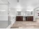 Modern bathroom with a soaking tub, glass shower, double vanity, and spacious layout at 6537 Ditmars St, Las Vegas, NV 89166