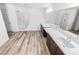 Bathroom featuring double sinks, tile floors, soaking tub, and glass shower at 6537 Ditmars St, Las Vegas, NV 89166