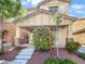 Inviting two-story home with a covered front porch, landscaped yard, and manicured landscaping at 6537 Ditmars St, Las Vegas, NV 89166