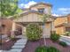 Charming two-story home featuring a landscaped front yard and inviting covered porch at 6537 Ditmars St, Las Vegas, NV 89166