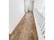 Hallway with carpeted floor leading to other rooms, with white railing on one side at 6537 Ditmars St, Las Vegas, NV 89166