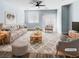 Bright living room features modern decor, a ceiling fan, and plenty of natural light at 6537 Ditmars St, Las Vegas, NV 89166