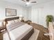 Cozy main bedroom with a comfortable bed, ceiling fan, and closet at 6537 Ditmars St, Las Vegas, NV 89166