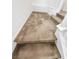 Carpeted staircase landing with neutral color palette and white trim at 6537 Ditmars St, Las Vegas, NV 89166