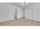 Bright, minimalist bedroom featuring natural light, a closet, and modern decor at 6700 Pine Needle Ct, Las Vegas, NV 89108