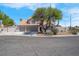 Charming two-story home features a three car garage and a well-maintained, landscaped front yard at 6700 Pine Needle Ct, Las Vegas, NV 89108