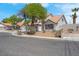 Charming single-Gathering home with a tile roof, well-manicured landscaping, and neutral-colored exterior at 6700 Pine Needle Ct, Las Vegas, NV 89108
