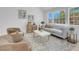 Elegant living room features modern furniture, natural light, and a comfortable seating area at 6700 Pine Needle Ct, Las Vegas, NV 89108