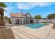 Inviting backyard pool with an adjacent covered patio and mature shade trees, perfect for relaxation at 6700 Pine Needle Ct, Las Vegas, NV 89108