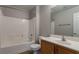 Bathroom with a shower-tub combo and a wooden vanity with sink at 6777 Wormwood Ln, Las Vegas, NV 89148