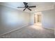 Upstairs bedroom with neutral carpet, large windows for natural light, and easy access to hallway at 6777 Wormwood Ln, Las Vegas, NV 89148