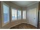 Cozy dining nook featuring bright windows with plantation shutters and wood-style flooring at 6777 Wormwood Ln, Las Vegas, NV 89148