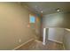 Carpeted staircase featuring neutral paint, white trim, and natural light at 6777 Wormwood Ln, Las Vegas, NV 89148
