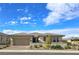 Charming single story home with a two car garage, desert landscaping, and a welcoming front entryway at 701 Monroe Hill Pl, Henderson, NV 89011