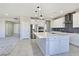 Modern kitchen with a large island, stainless steel appliances, and ample cabinet space at 701 Monroe Hill Pl, Henderson, NV 89011