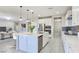 Bright, open kitchen featuring a large center island, stainless steel appliances, and modern finishes at 701 Monroe Hill Pl, Henderson, NV 89011