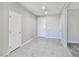 Spacious living room featuring tile flooring and neutral wall paint at 701 Monroe Hill Pl, Henderson, NV 89011
