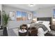 Serene main bedroom showcasing a comfortable bed, stylish decor, and plenty of natural light at 701 Monroe Hill Pl, Henderson, NV 89011