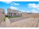 Backyard featuring artificial grass, a trampoline, patio, and privacy walls at 7128 Port Stephens St, North Las Vegas, NV 89084