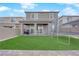 Backyard featuring artificial grass, a covered patio, and privacy walls at 7128 Port Stephens St, North Las Vegas, NV 89084