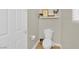 Cozy half bathroom with toilet, decorative shelf, and modern fixtures at 7128 Port Stephens St, North Las Vegas, NV 89084