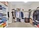 Organized walk-in closet with shelving, hanging racks, and ample storage space at 7128 Port Stephens St, North Las Vegas, NV 89084