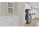 Gourmet kitchen area featuring stainless steel appliances, white cabinets, and ample counter space at 7128 Port Stephens St, North Las Vegas, NV 89084