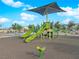 Community playground featuring slides, climbing structures, and a shaded play area at 7128 Port Stephens St, North Las Vegas, NV 89084