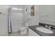 Bathroom featuring a shower-tub, marble countertop, and neutral walls at 748 Dellenbaugh Ct, Las Vegas, NV 89178