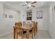 Dining room features a table set for six with neutral walls and tiled flooring at 748 Dellenbaugh Ct, Las Vegas, NV 89178