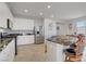 Beautiful kitchen featuring an island with a marble countertop and stainless steel appliances at 748 Dellenbaugh Ct, Las Vegas, NV 89178