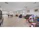 Bright and spacious open-concept living room with modern decor and tiled floors at 748 Dellenbaugh Ct, Las Vegas, NV 89178