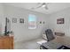 Well-lit office with desk, neutral walls, tile floors, and natural light at 748 Dellenbaugh Ct, Las Vegas, NV 89178
