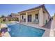 Inviting pool with a baja step and lounging area, perfect for relaxing and entertaining outdoors at 748 Dellenbaugh Ct, Las Vegas, NV 89178