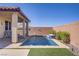 Backyard with a small pool, patio and privacy wall at 748 Dellenbaugh Ct, Las Vegas, NV 89178