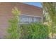A clear view of the Laurel Hills community signage, framed by greenery and a brick wall at 748 Dellenbaugh Ct, Las Vegas, NV 89178
