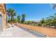 Spacious outdoor balcony with metal railing, beautiful landscape views and comfortable seating at 7751 Locke Haven Dr, Las Vegas, NV 89123