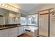 Bright bathroom featuring a double sink vanity, shower, and a bathtub at 7751 Locke Haven Dr, Las Vegas, NV 89123