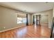 Bedroom with mirrored closet, window and wooden floors at 7751 Locke Haven Dr, Las Vegas, NV 89123