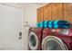 Laundry room featuring updated washer and dryer set, plus ample storage space at 7751 Locke Haven Dr, Las Vegas, NV 89123